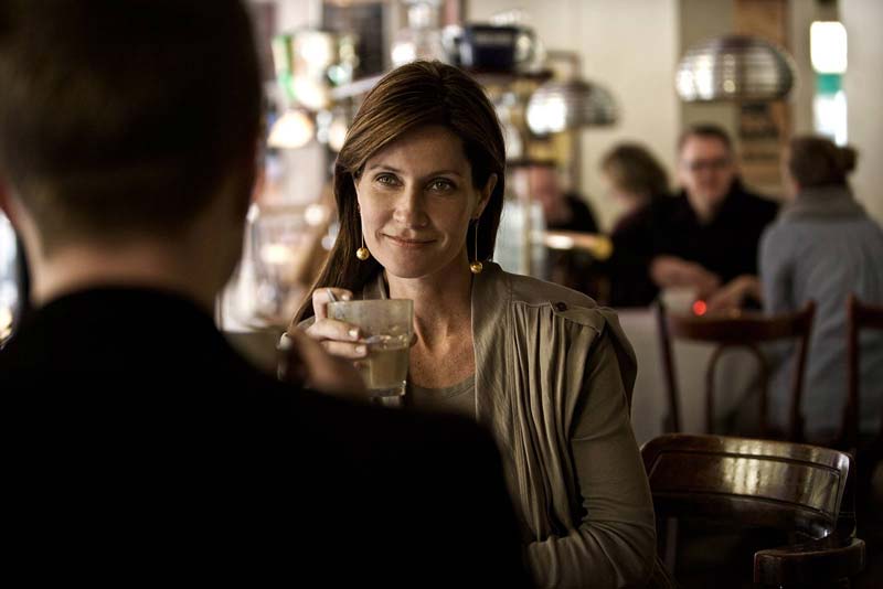 lady in cafe wearing hearing-aids